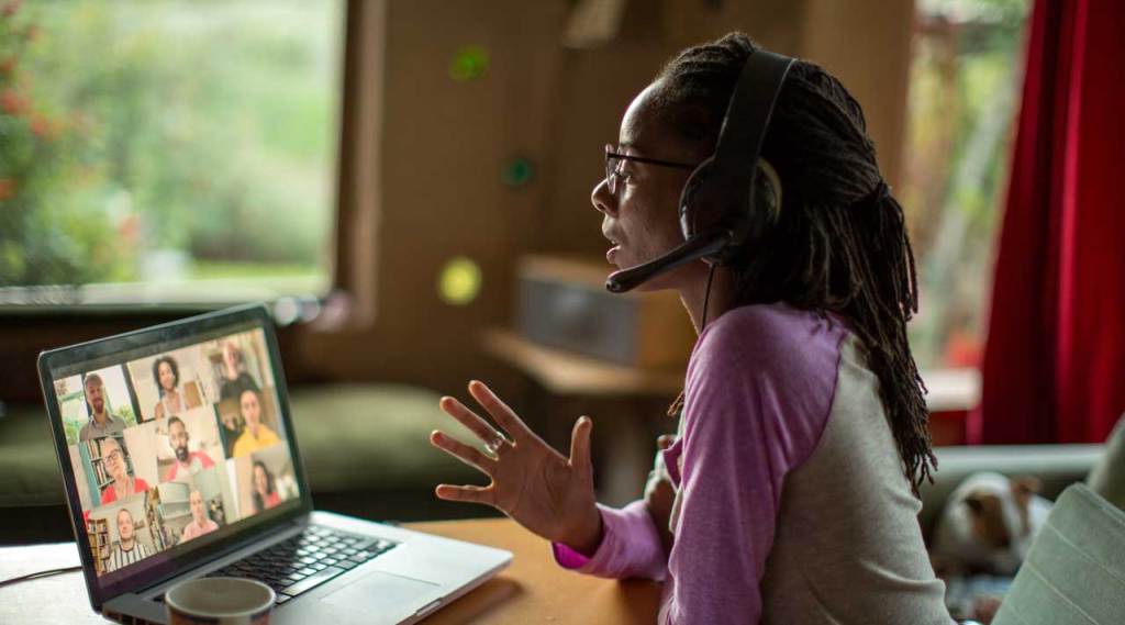 Woman with headset in an online meeting